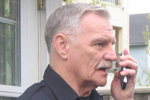 Security officer talking on phone